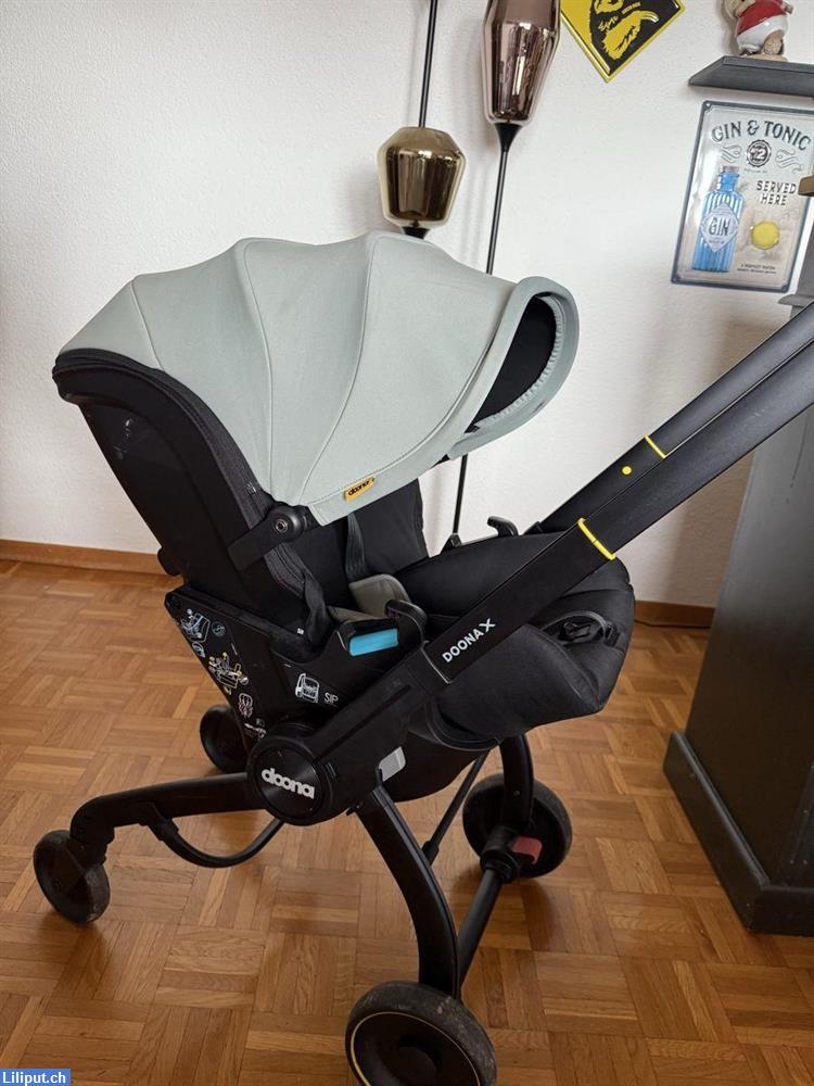 Bild 1: Doona X in Dusty Sage als Kinderwagen als auch als Autositz
